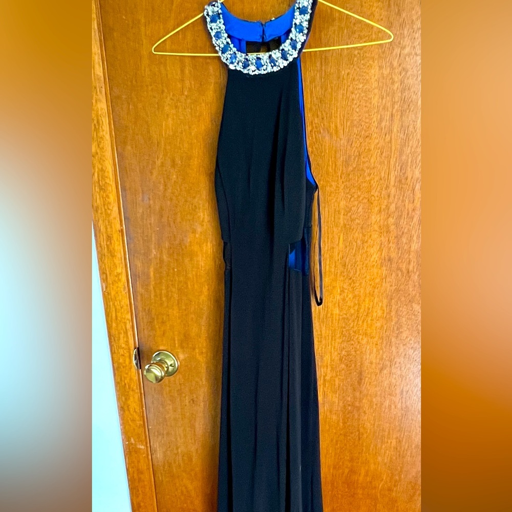 Beautiful black floor length gown with jeweled neckline and cut out sides